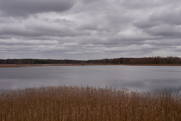 Cloudy sky over the autumn lake