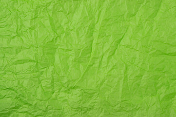 Crumpled green wrapping paper. Background .