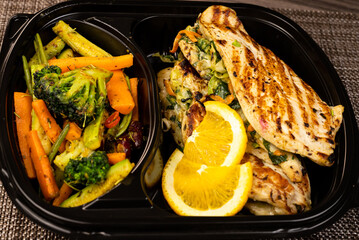 Grilled chicken breast with tomato , parsley and onion