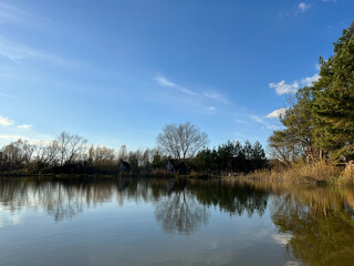 Autumn mood landscape with lake and forest in the perfect sunny weather