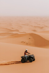 Fototapeta na wymiar ATV Quad sahara desert