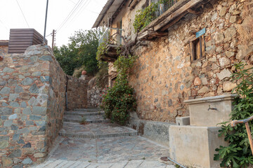 Old houses at the street of the ancient village Gourri