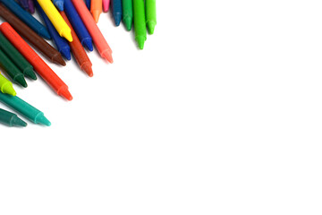 Crayons lined up isolated on white background.