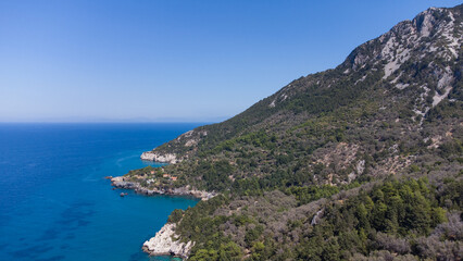 Fototapeta na wymiar Aerial view of turquoise blue Mediterranean water on the coast of Samos, Greek Aegean Sea