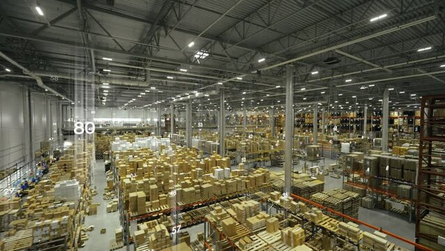 Top view of manufacture warehouse with logistics numbers holograph over cardboard boxes