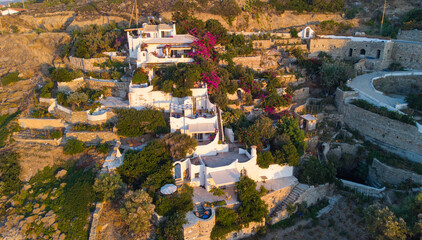 Top view of beautiful Greek architecture buildings on the shore of the Aegean Sea  - obrazy, fototapety, plakaty