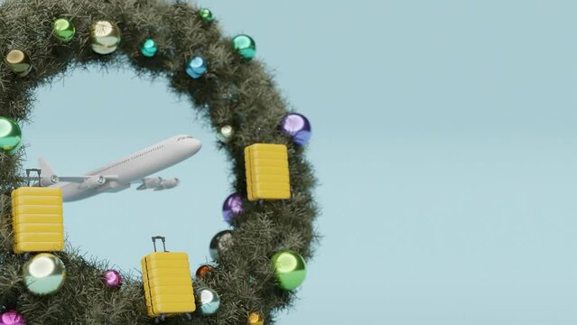 airplane travel concept . christmas decoration with suitcase on blue background with copyspace