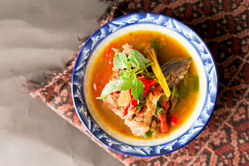 Yellow gravy fish. cooked with turmeric and a mixture of tamarind makes it taste savory and fresh.