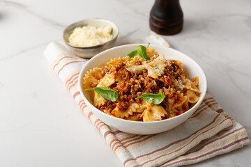 Close up of bolognese italian pasta in white bowl