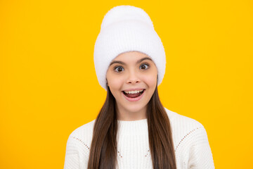 Close up emotional portrait of caucasian smiling teen girl. Head shot of cute teenager child on isolated studio background.