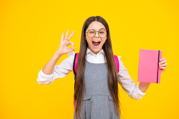 Excited face. Back to school. Portrait of teenage school girl with books. Children school and education concept. Schoolgirl student. Amazed expression, cheerful and glad.