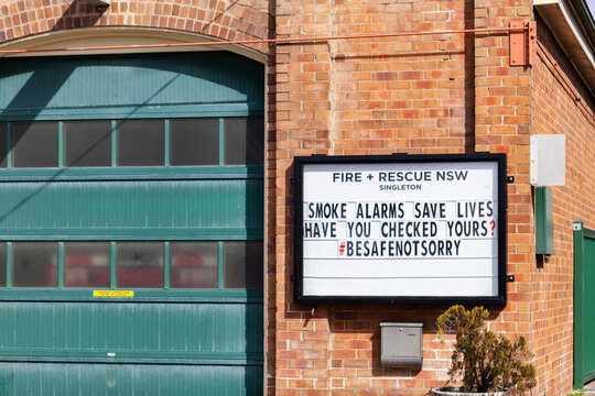 Check Your Smoke Alarms Stay Safe Warning Sign On Wall Of Fire Brigade Building