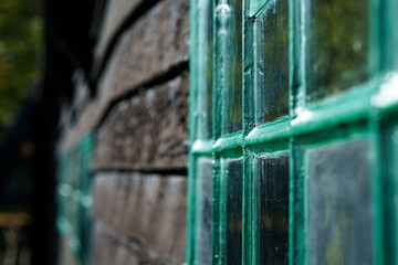 Vintage old wooden barn with small square windows