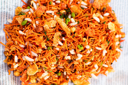 Closeup of Bhelpuri Chaat on Paper - Tasty Indian Street Food - Selective Focus