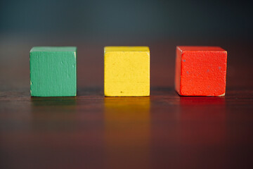 Image of emotions on Choosing a positivewooden blocks. Joy, calm, anger. Mental health and emotional state concept
