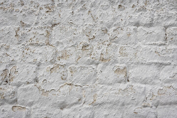 Mur de pierre peint en blanc