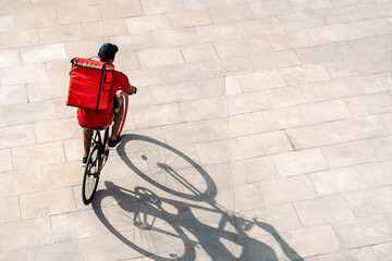 Delivery Man Riding Bike - obrazy, fototapety, plakaty