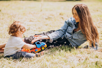 Fototapeta premium Mother with her little son together in park