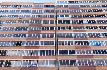 High-rise multi-storey building from below, many windows