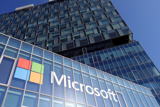 Logo of Microsoft company headquarters is photographed on a office building. American multinational corporation which produces computer software. IT Industry and software.Romania, Bucharest,May 2022.
