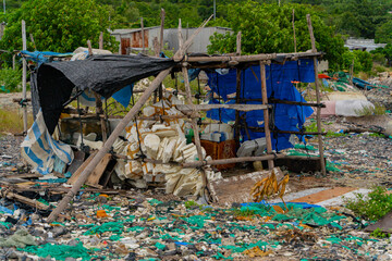 Garbage on the seashore.  The photo was taken in cloudy weather in Vietnam. 