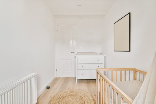 Crib and commode in bedroom