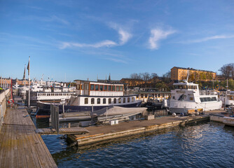 Moored old commuting ferries in the harbor a sunny autumn day in Stockholm