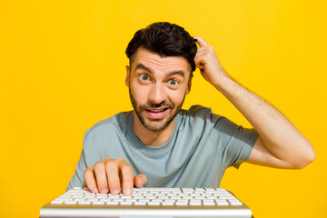 Closeup photo of young smart programmer sitting looking monitor typing keyboard computer working...