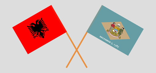 Crossed flags of Albania and The State of Delaware. Official colors. Correct proportion