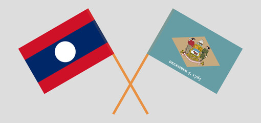 Crossed flags of Laos and The State of Delaware. Official colors. Correct proportion.
