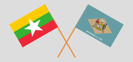 Crossed flags of Myanmar and The State of Delaware. Official colors. Correct proportion