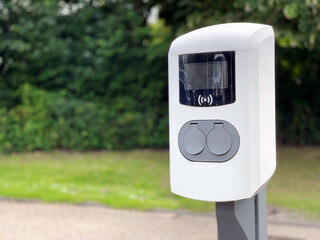Charging station for electricity to e-cars at a car park