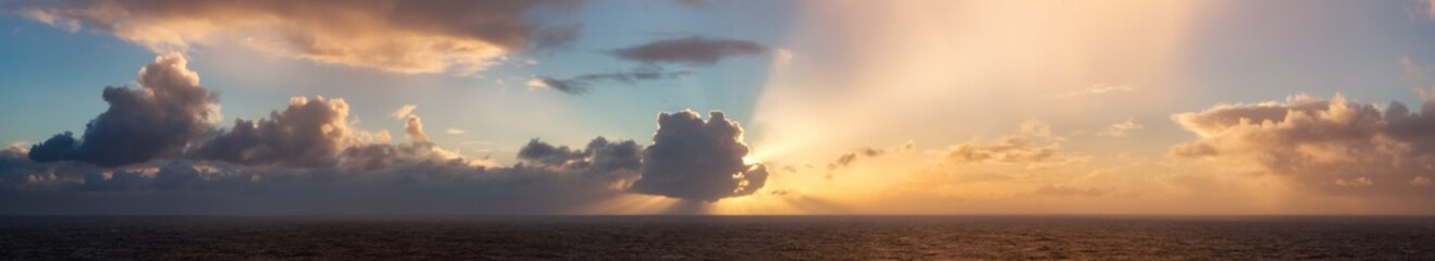 Dramatic Colorful Sunrise Sky over North Atlantic Ocean. Cloudscape Nature Background. Panorama