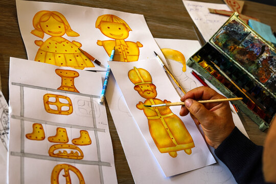 For Saint Nicholas, the animator draws characters from cartoons, comics or puppet shows. Preparation for making a doll. The designer creates sketches. Comics, cartoons, puppet theater
