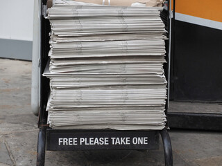 Free please take one newspaper