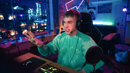 Excited Streamer Talking and Entertaining Followers During Live Broadcast Online. Stylish Man...