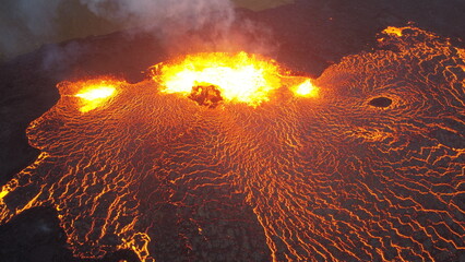 Eruption of the Fagradalsfjall volcano in Iceland. Hot lava stream flowing from the crater.