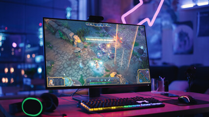 Gaming at Home: Empty Gaming Station with Player's Personal Computer with RPG Strategy Gameplay on Display. Standing on a Wooden Desk in Stylish Loft Apartment with Neon Lights. © Gorodenkoff