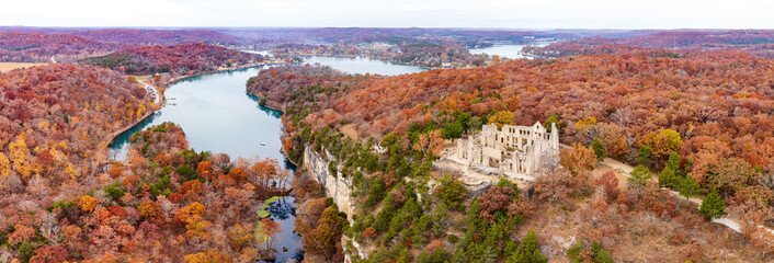 Aerial view of the fall color of Lake Ozark and the castle ruins
