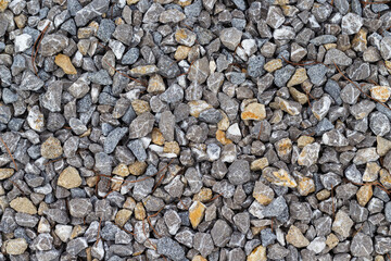Close-up of the texture of multi-colored granite rubble.