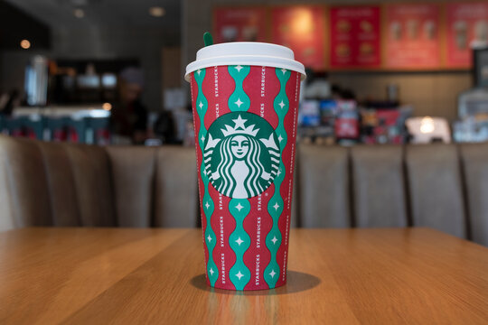 Starbucks holiday coffee cup. Each year, Starbucks celebrates holidays with Christmas colored cups and Pumpkin Spice Lattes.