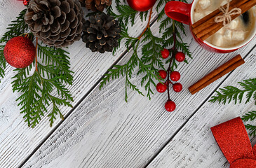Christmas card with toys, fir branches and a garland.Decor with sweets, cinnamon.
