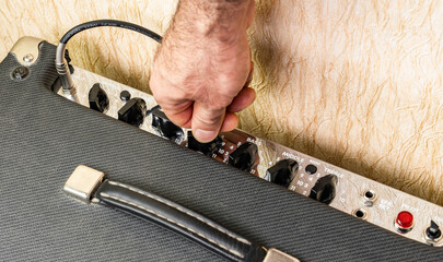 Turning the effects knob on the combo amp