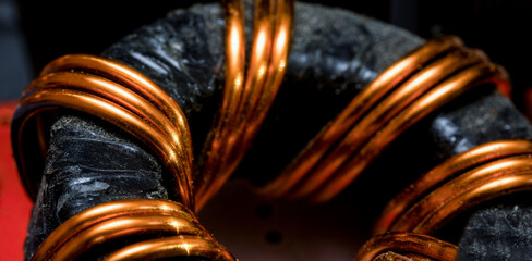 Inductor with copper wire on black background