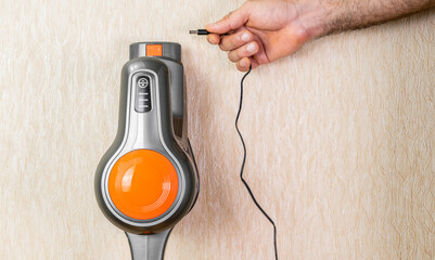 Charging the cordless vacuum cleaner