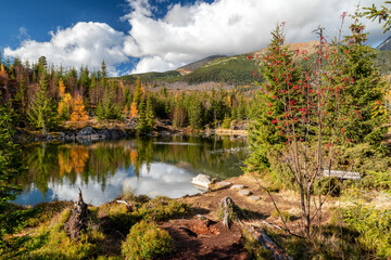 Mountain lake called Rakytovske pliesko in autumn colors in High Tatras mountains in Slovakia