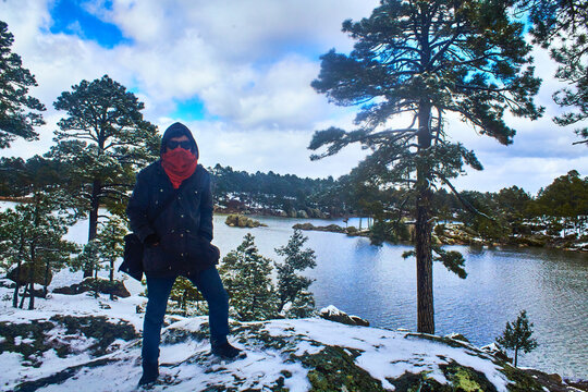 lake on winter with trees covered of snow in arareco lake, creel chihuahua 