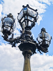 Fototapeta na wymiar Ornate iron and glass street lamp