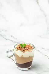 dessert three chocolates with mint on a light background. Layered delicious dessert. vertical image. place for text