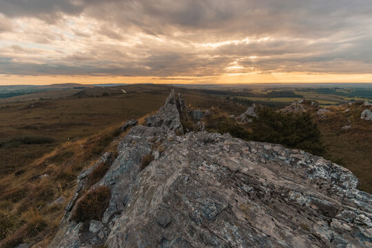 Rocky landscape at Roc'h Trevezel summit on a autumn evening during golden hour at sunset, Parc naturel regional d'Armorique, Brittany, France